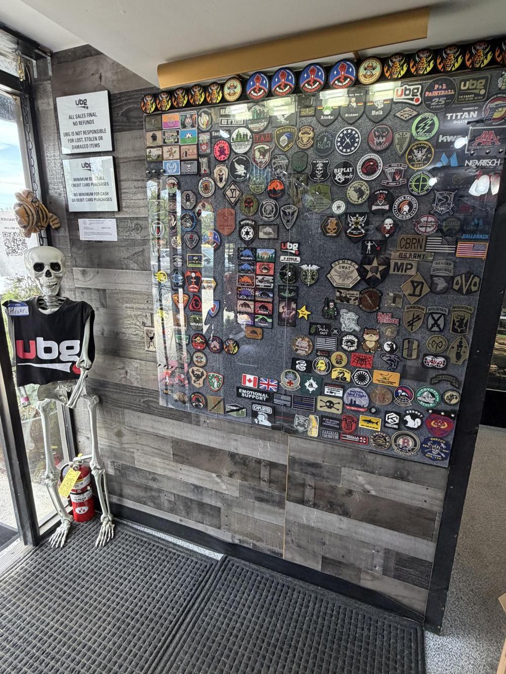 Patch wall next to a skeleton wearing a UBG shirt