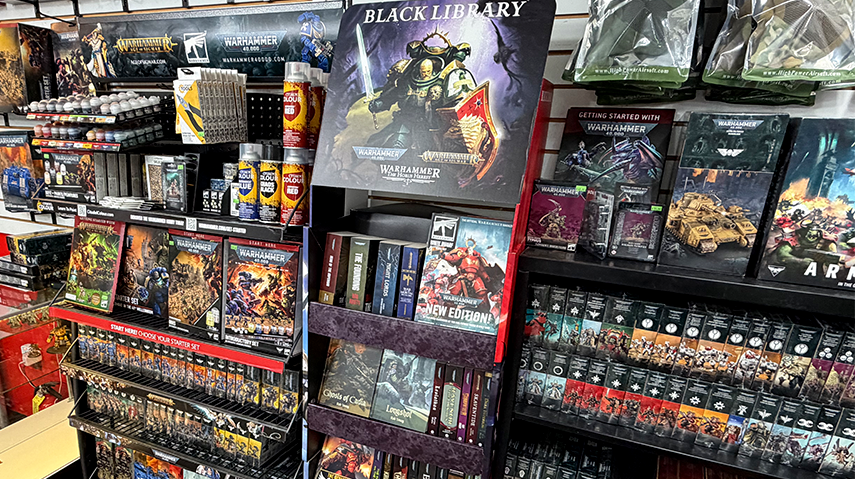 Games Workshop kits, books and paints on the shelves
